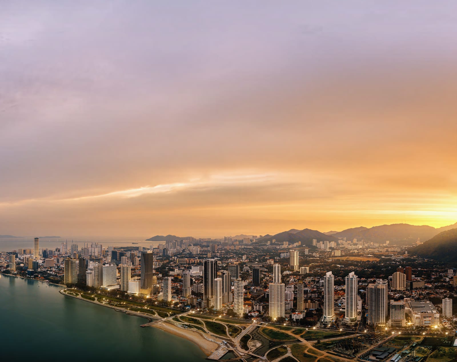 Penang coastline and Gurney Bay at sunset with city lights