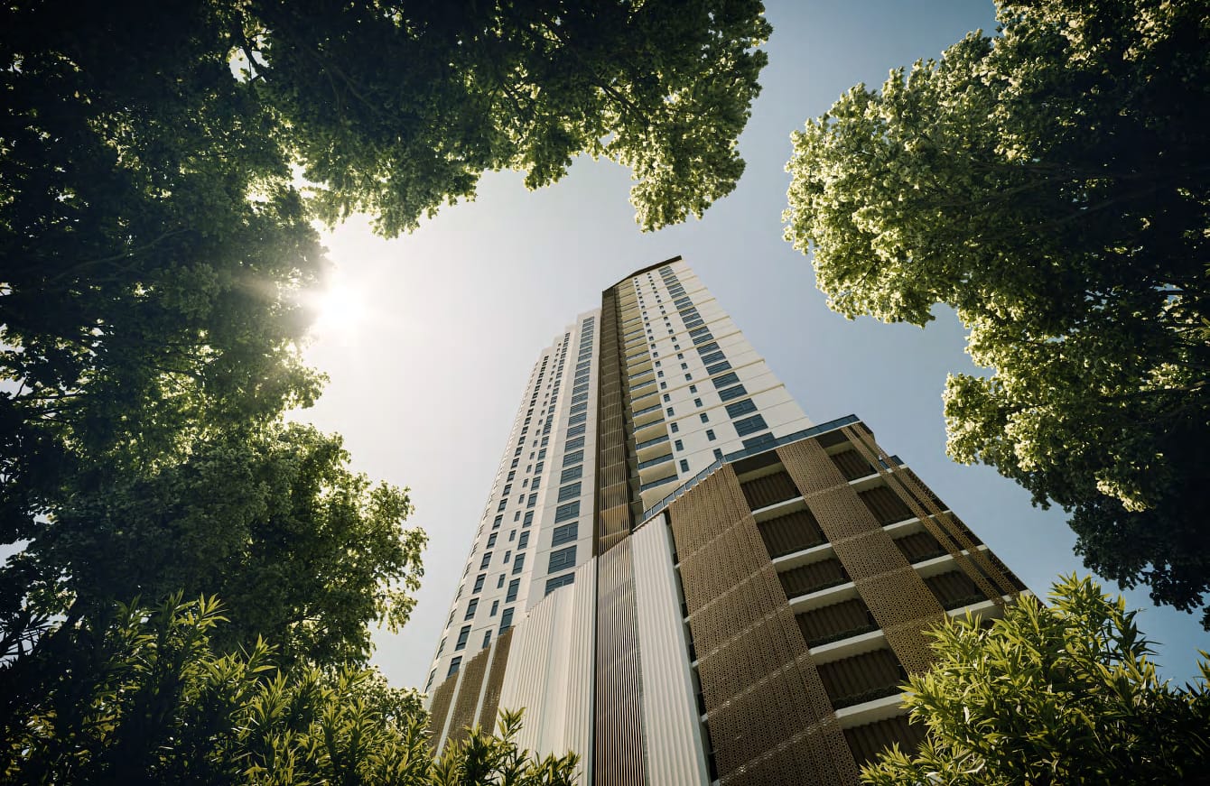 Looking up at the Cantonment Residence facade framed by tree canopy