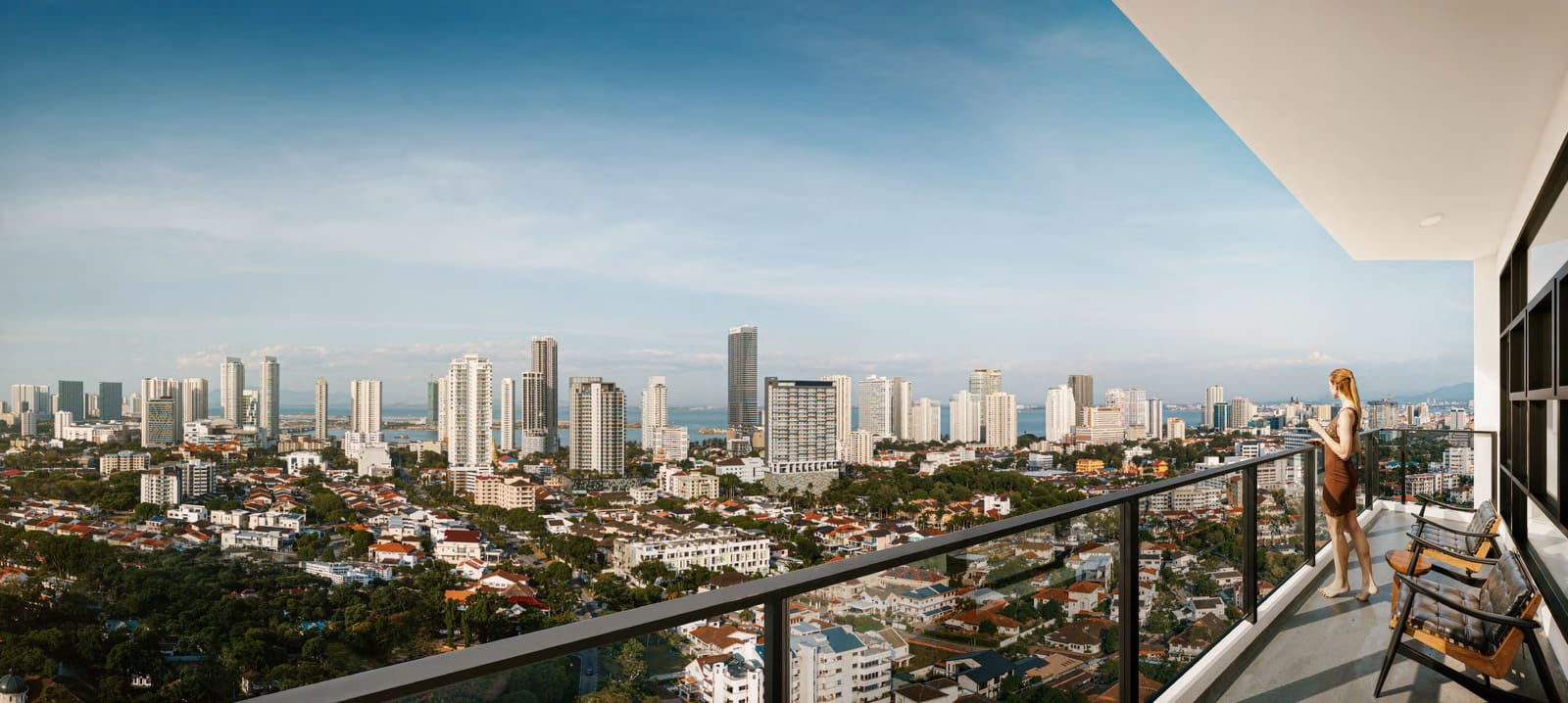 Resident on a glass balcony overlooking the Penang skyline and sea